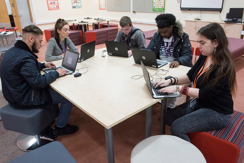 students on laptops